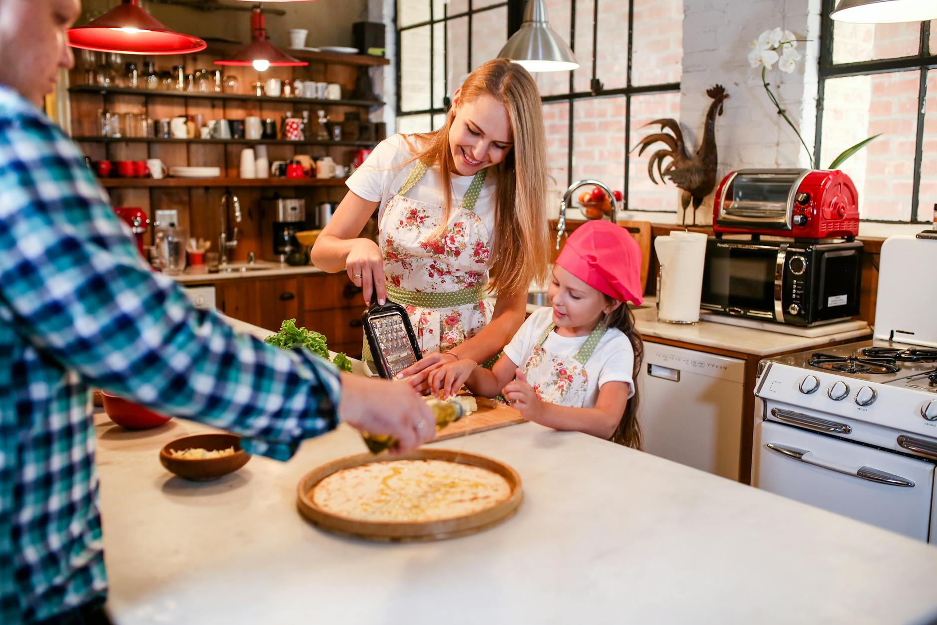 a family bonding time preparing food on kitchen counter table