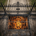 Large mechanical gears glowing orange behind a barred metal grate underground